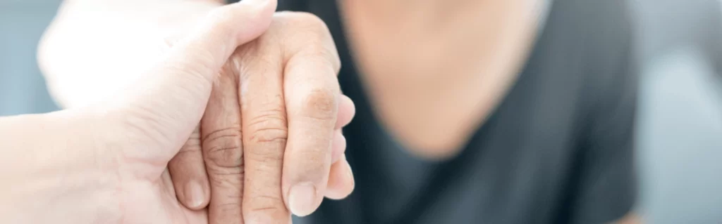 close up of hand being helped