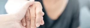 close up of hand being helped